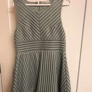 Mint green A-line cocktail dress with cutout waist